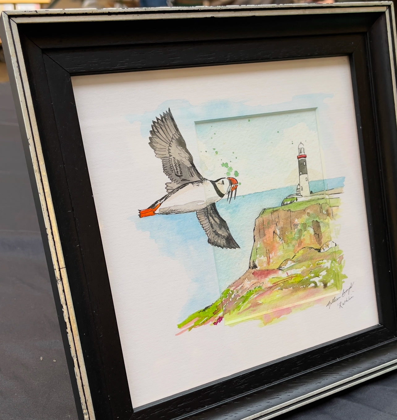 Puffins over Rathlin Lighthouse